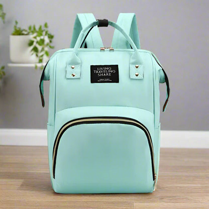 sac à langer vert au dos